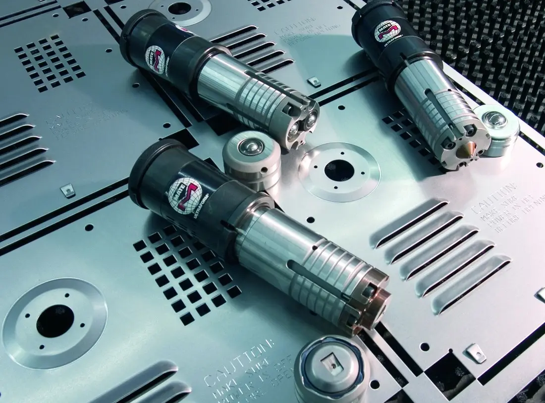 Mate Precision Technologies Ultraform tooling on a sheet metal panel punched on a CNC turret press